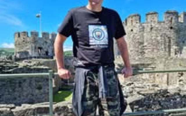 Director Chris enjoying some well-earned downtime, soaking up the sunshine and history at a castle in true holiday style.
